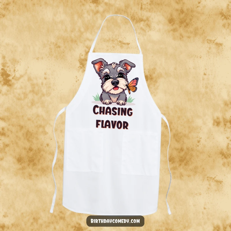 Funny schnauzer apron featuring a dog intently watching a butterfly, a humorous and practical kitchen accessory.