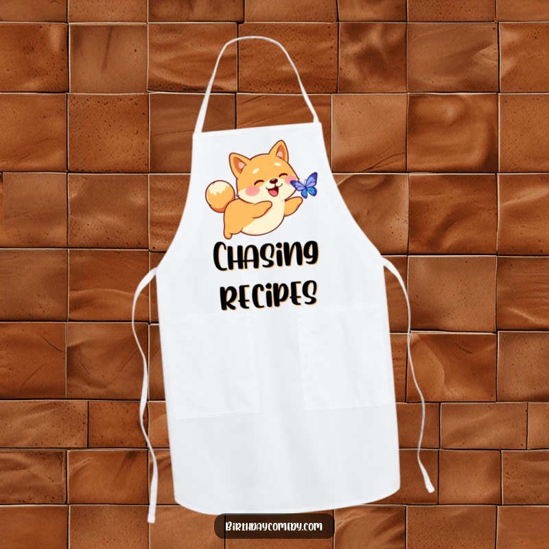 Funny apron design with a happy Shiba Inu with a perky tail, chasing a digital butterfly, perfect for techy kitchens.