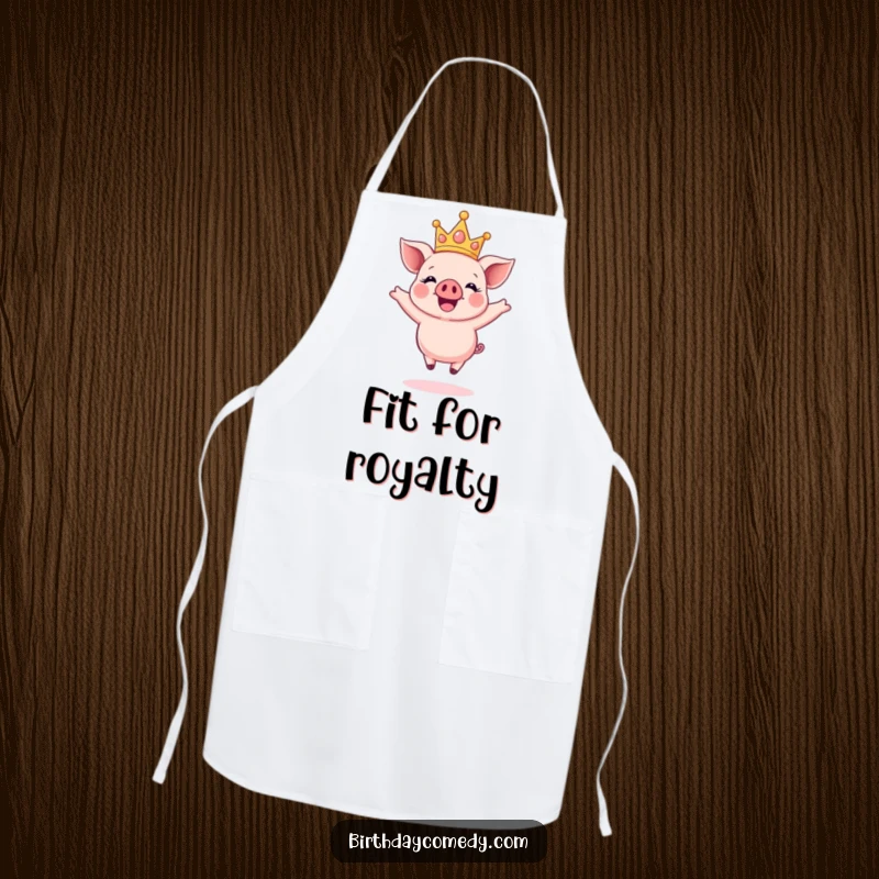 Funny apron with a happy piglet wearing a sparkly crown, joyfully jumping mid-air, perfect for happy cooking.