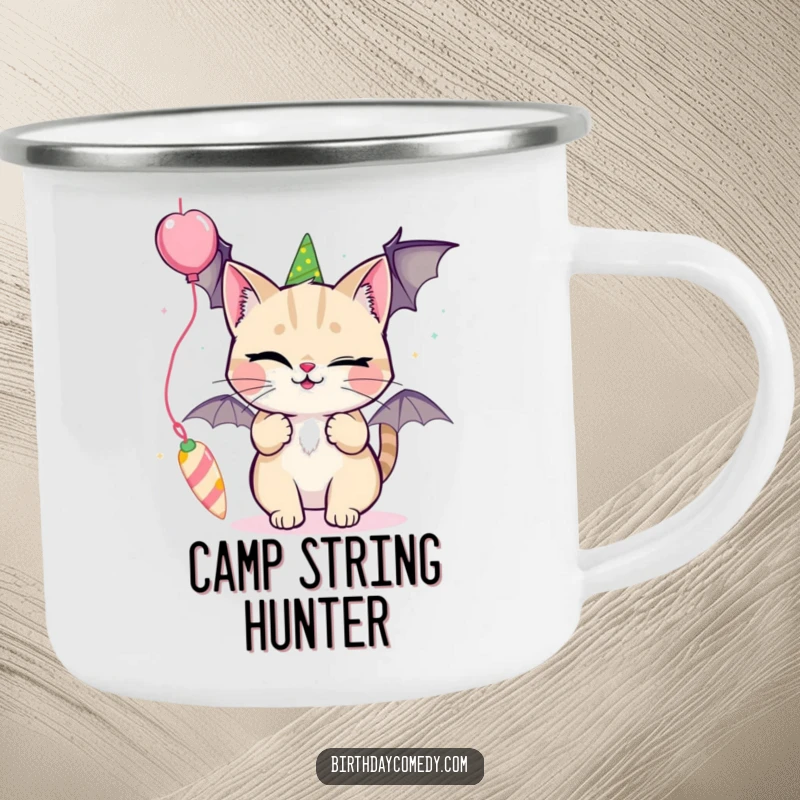 Funny camping mug featuring a winking cat playfully batting at a dangling party streamer.