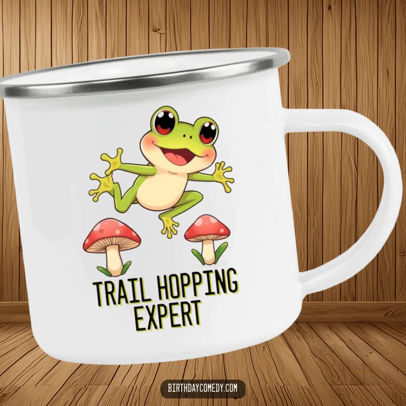 Funny enamel camping mug showing a joyful frog with wide, curious eyes leaping between mushroom caps, perfect for outdoor enthusiasts.