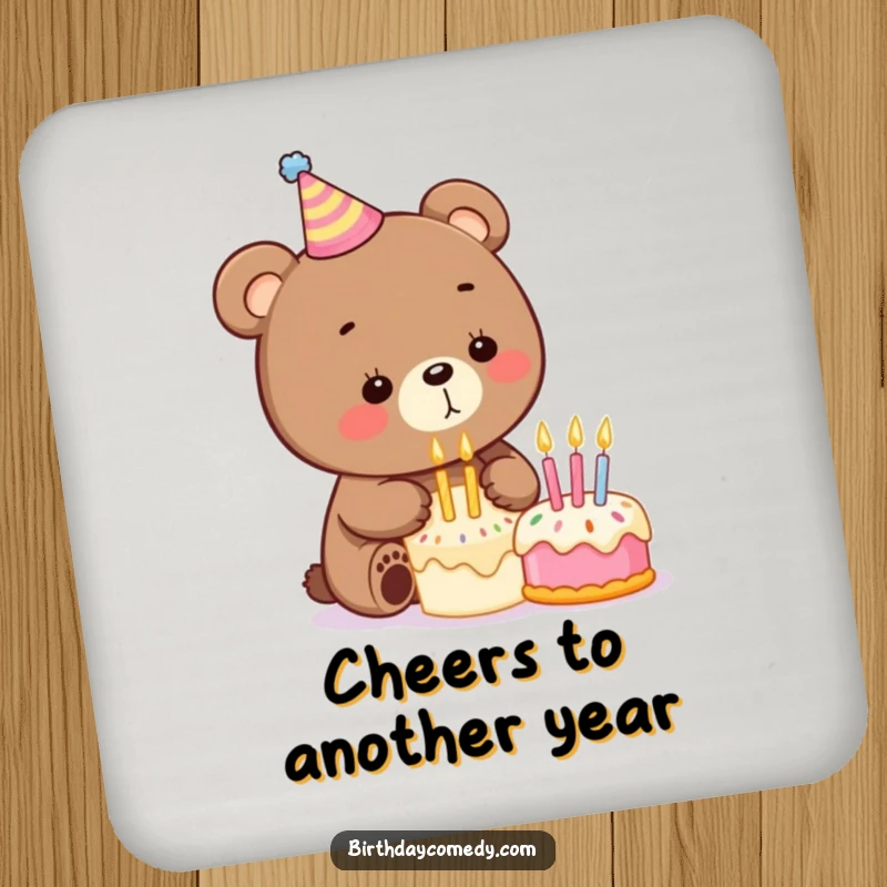 Funny birthday drink coasters showcasing a playful bear with a party hat blowing out candles on a small cake, protecting table surfaces.