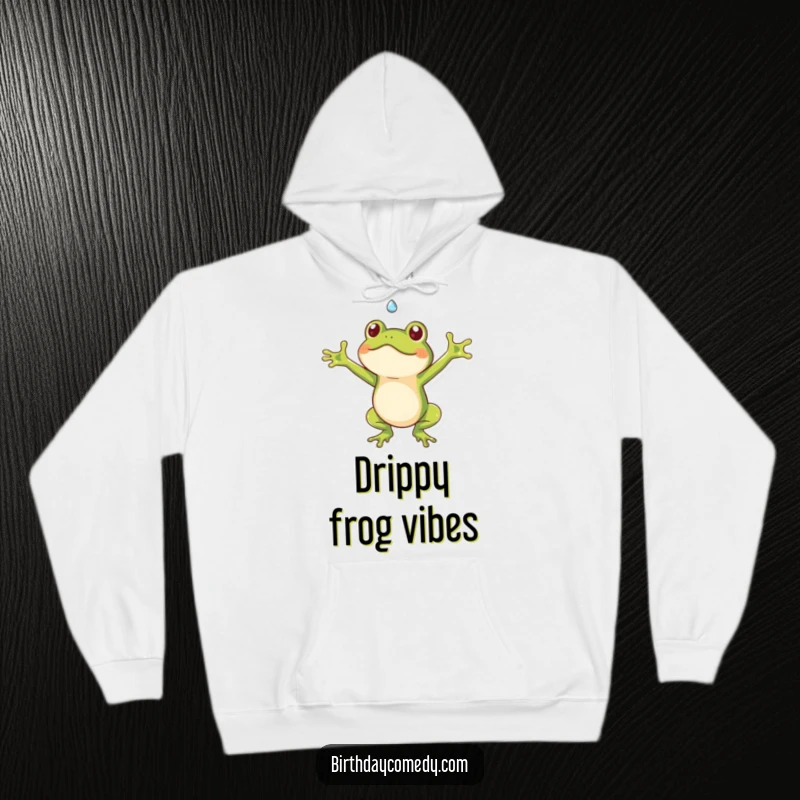 Funny frog hoodie depicting a playful frog with open arms catching a falling dewdrop, a cozy and humorous apparel choice.