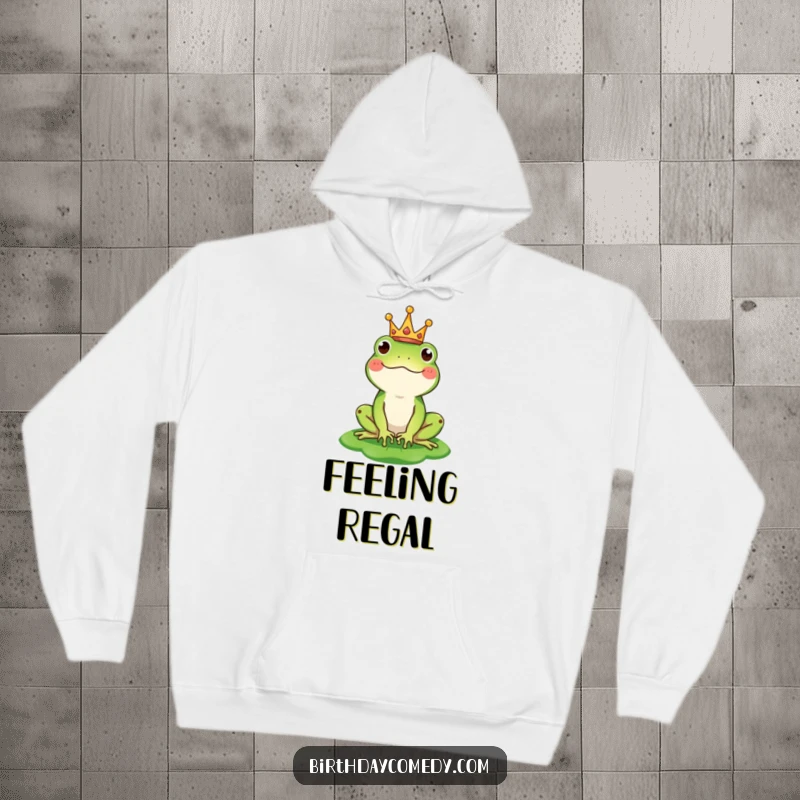 Funny hoodie with a happy frog character wearing a small crown and sporting a lily pad hat, perfect for cozy, regal vibes.