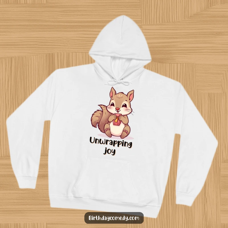 Funny hoodie featuring a playful squirrel joyfully unwrapping a present, ideal for cozy and humorous holiday or gift-themed wear.