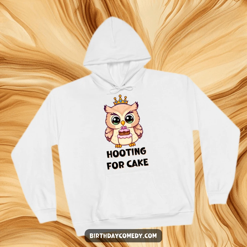 Funny owl hoodie, a cheerful owl wearing a birthday crown and holding a tiny cake, perfect for cozying up with festive cheer.