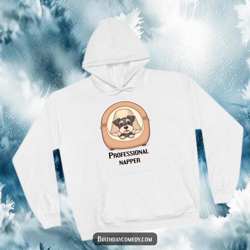 Funny schnauzer puppy hoodie depicting a cute dog peeking from a cozy bed, exuding warmth and humorous charm.