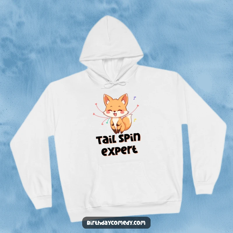 Funny fox hoodie, a happy fox with streamers entwined around its tail, joyfully twirling, perfect for cozying up with festive cheer.