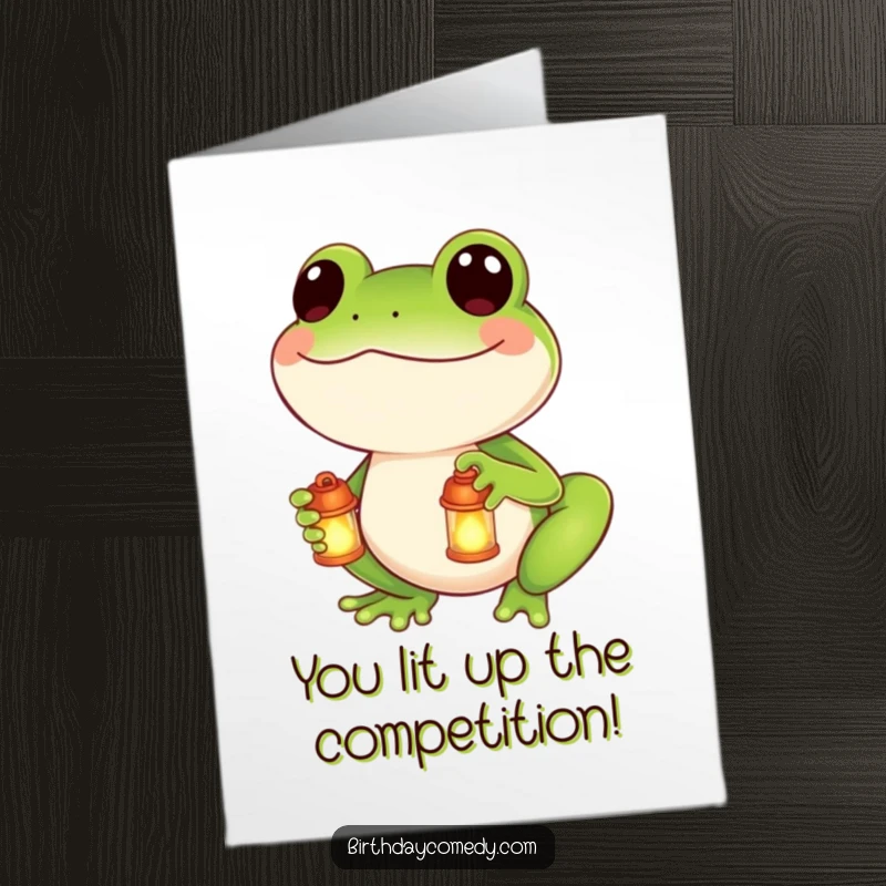Funny Free Printable Congrats Card: Smiling frog with a glowing lantern congratulates success with warm wishes.