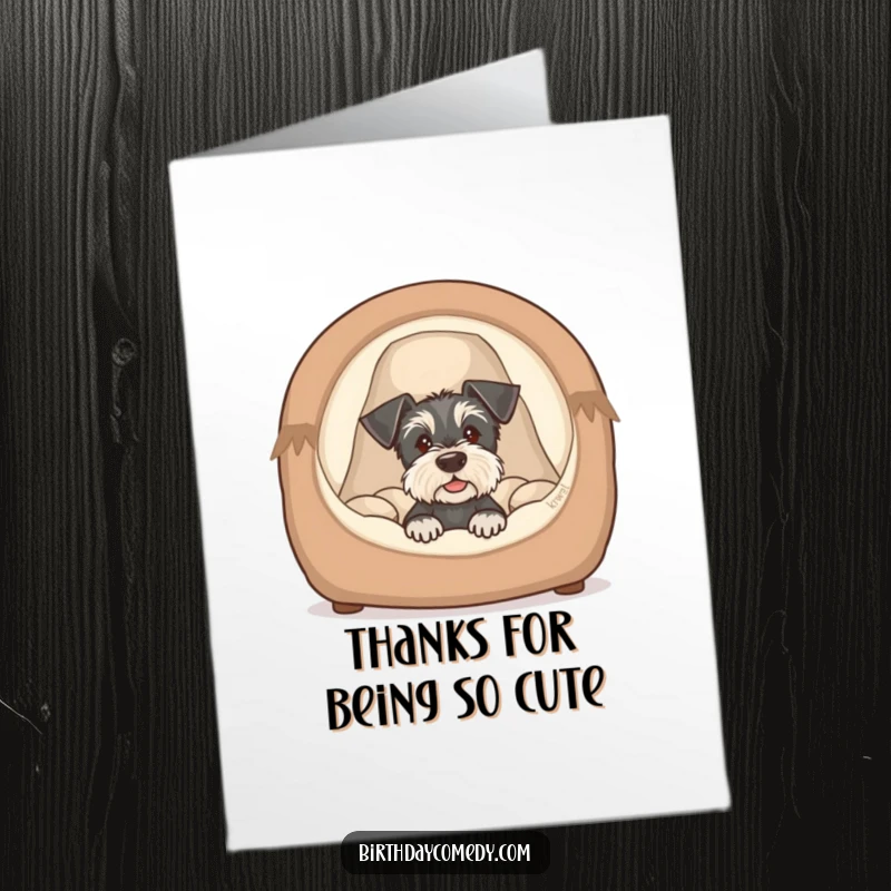 Funny Free Printable Thank You Card: Schnauzer puppy peeking from a cozy dog bed, cute and humorous thank you, downloadable.