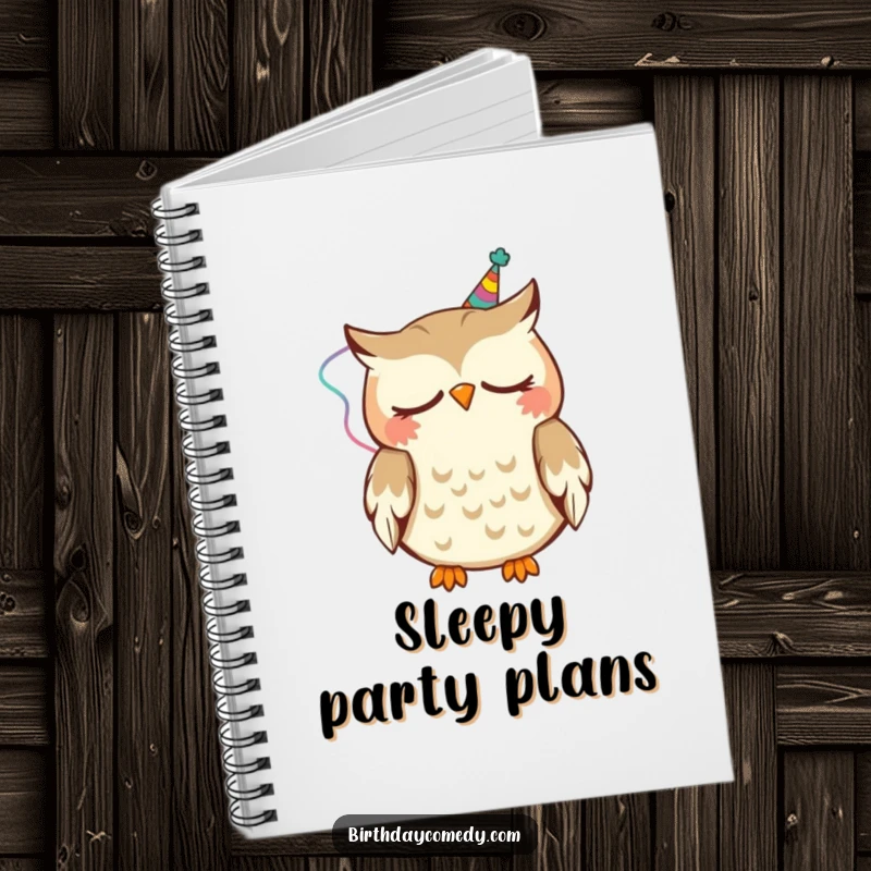Funny Notebook with a cover showing a sleepy owl wearing a party streamer, happily nodding, perfect for note-taking.