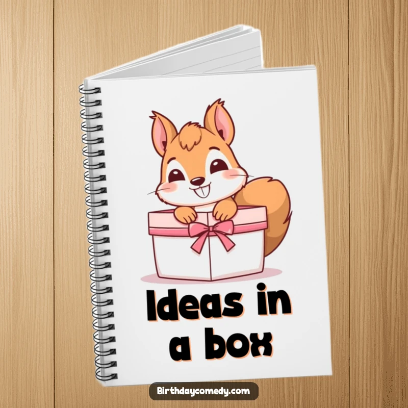 Funny Notebook with a cover showing a curious squirrel with a grin, peeking out of a gift box, perfect for note-taking.