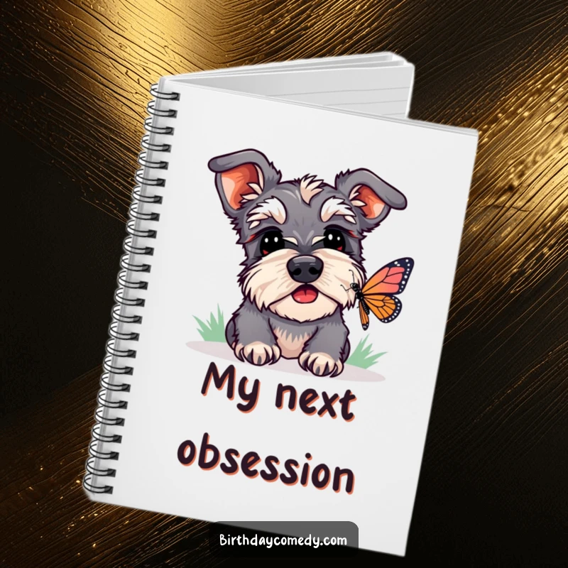 Funny schnauzer notebook depicting a dog watching a butterfly, ideal for jotting notes with a curious and humorous vibe.