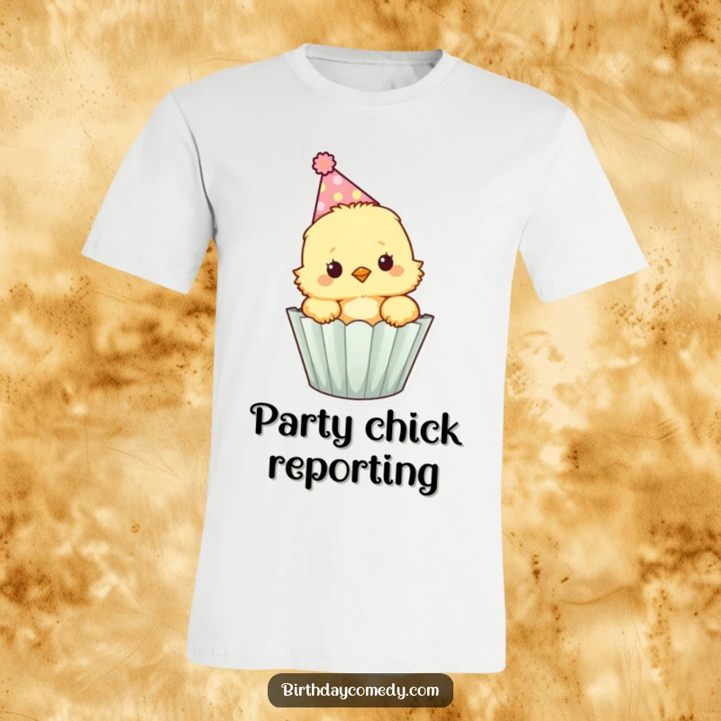 Funny fluffy chick wearing a party hat peeks out of a cupcake wrapper, printed on a soft and comfortable t-shirt.