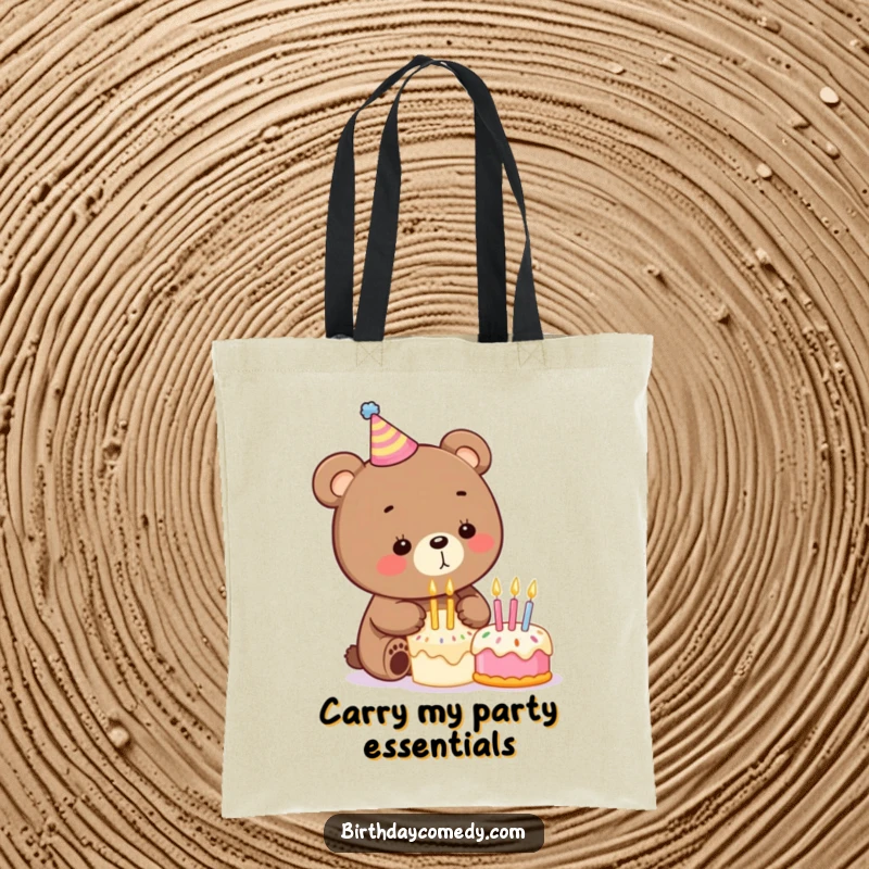 Funny birthday tote bag displaying a playful bear wearing a party hat and blowing out candles on a tiny cake, perfect for celebrations.